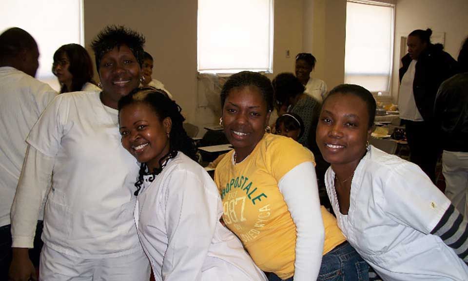 A group of women are posing for a picture and one of them is wearing a shirt that says aeropostale