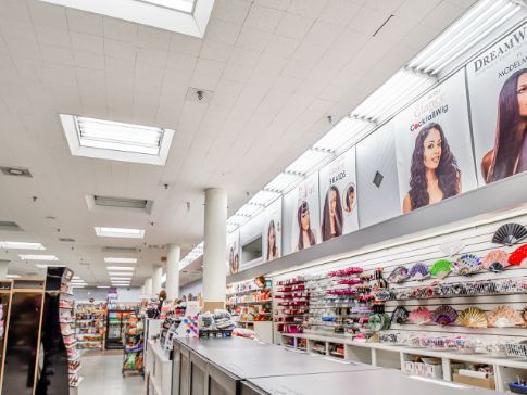 A large store filled with lots of shelves and tables.