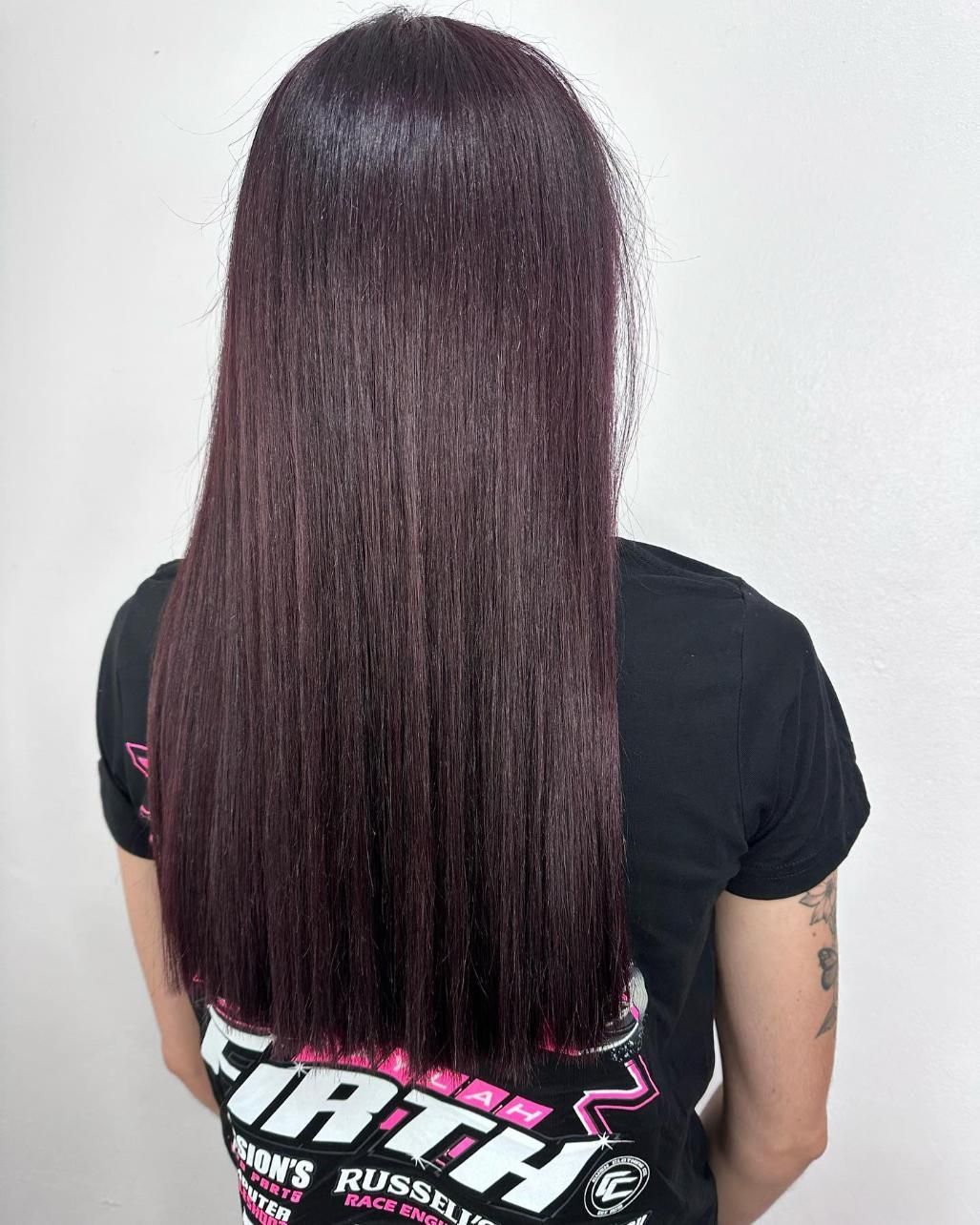 A Woman With Long Purple Hair Is Wearing A Fifth Shirt — Freedom Hairdressing In Casino, NSW