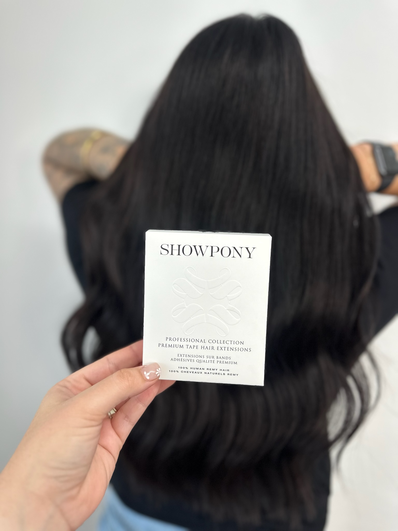 A Woman With Long Blonde Hair Is Standing In A Room — Freedom Hairdressing In Casino, NSW