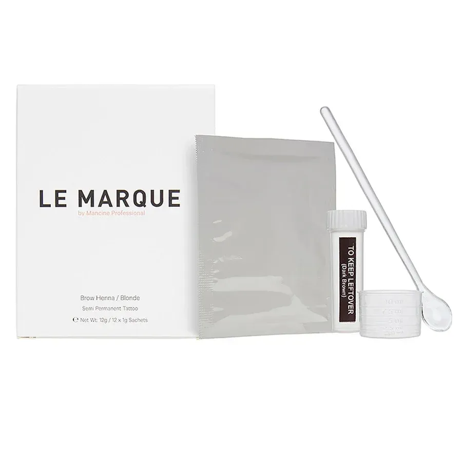 A Woman Is Laying In A Sink With A Pair Of Gold Eye Patches On Her Face — Freedom Hairdressing In Casino, NSW