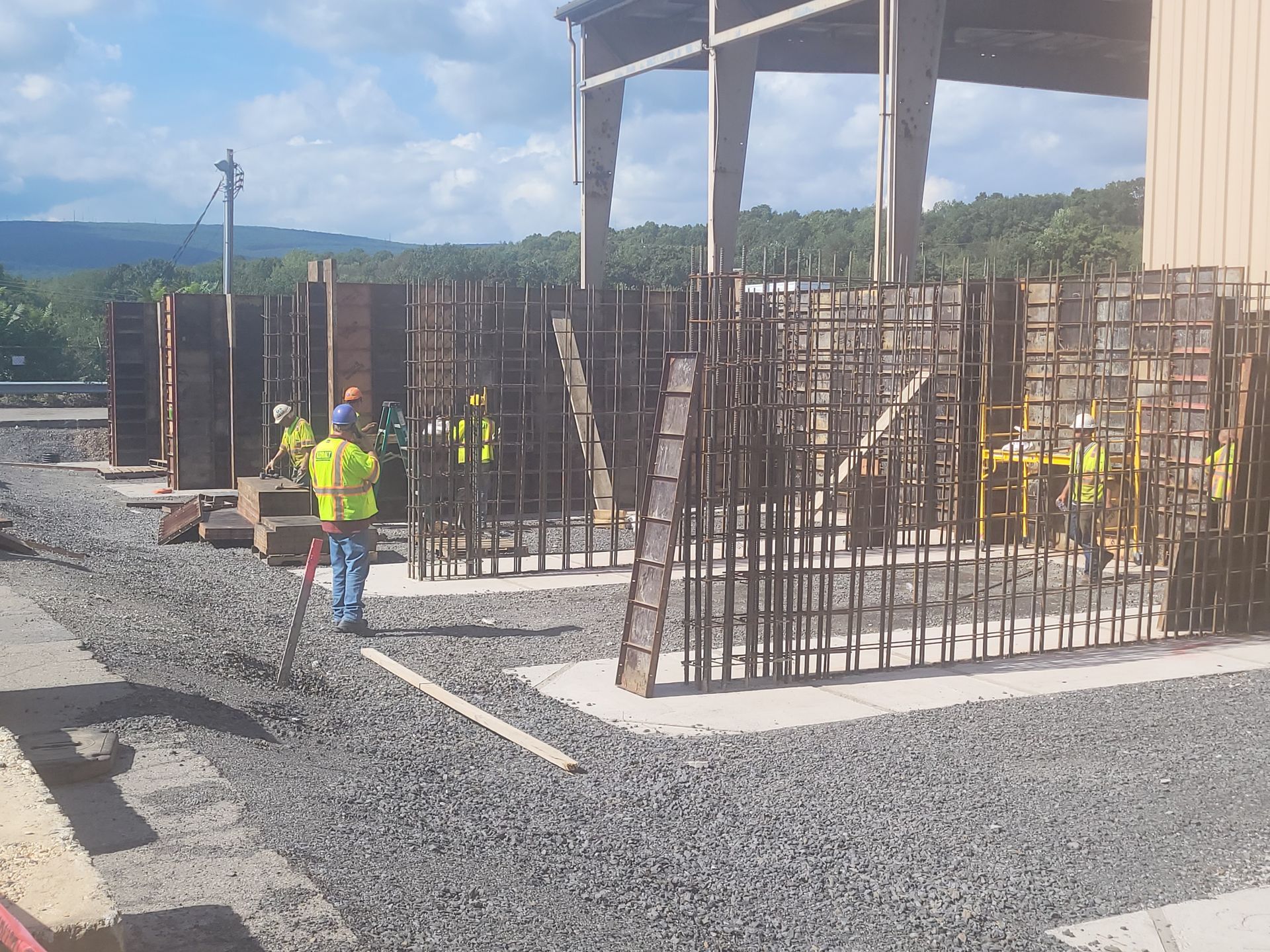 a group of Kobalt construction workers are working on a building