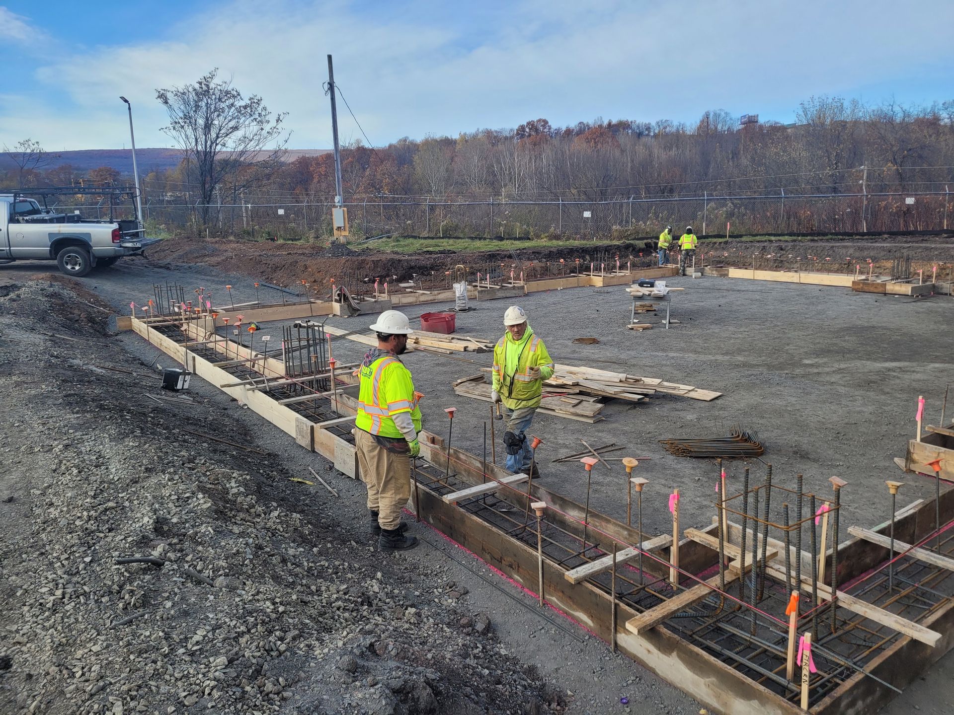A group of construction workers are working on a construction site.