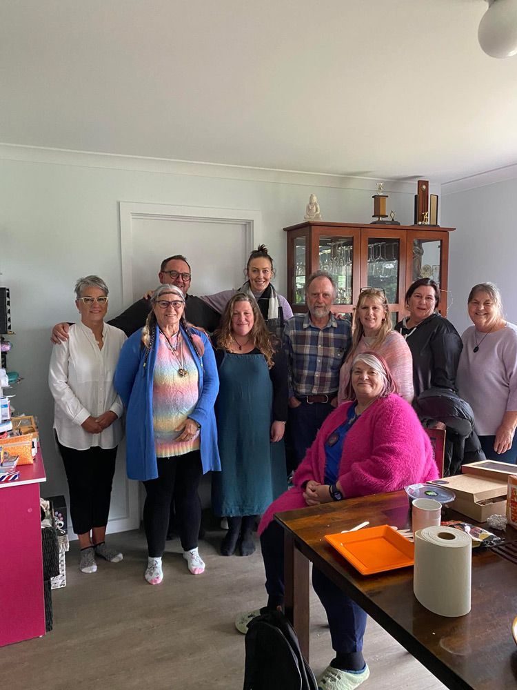 A Group of People Are Posing for A Picture in A Living Room — Medium in Bakery Hill, VIC