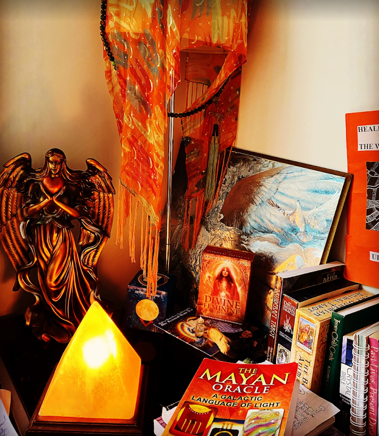 A Crystal Ball, Candle, and Crystals Placed On A Wooden Table — Medium in Bakery Hill, VIC