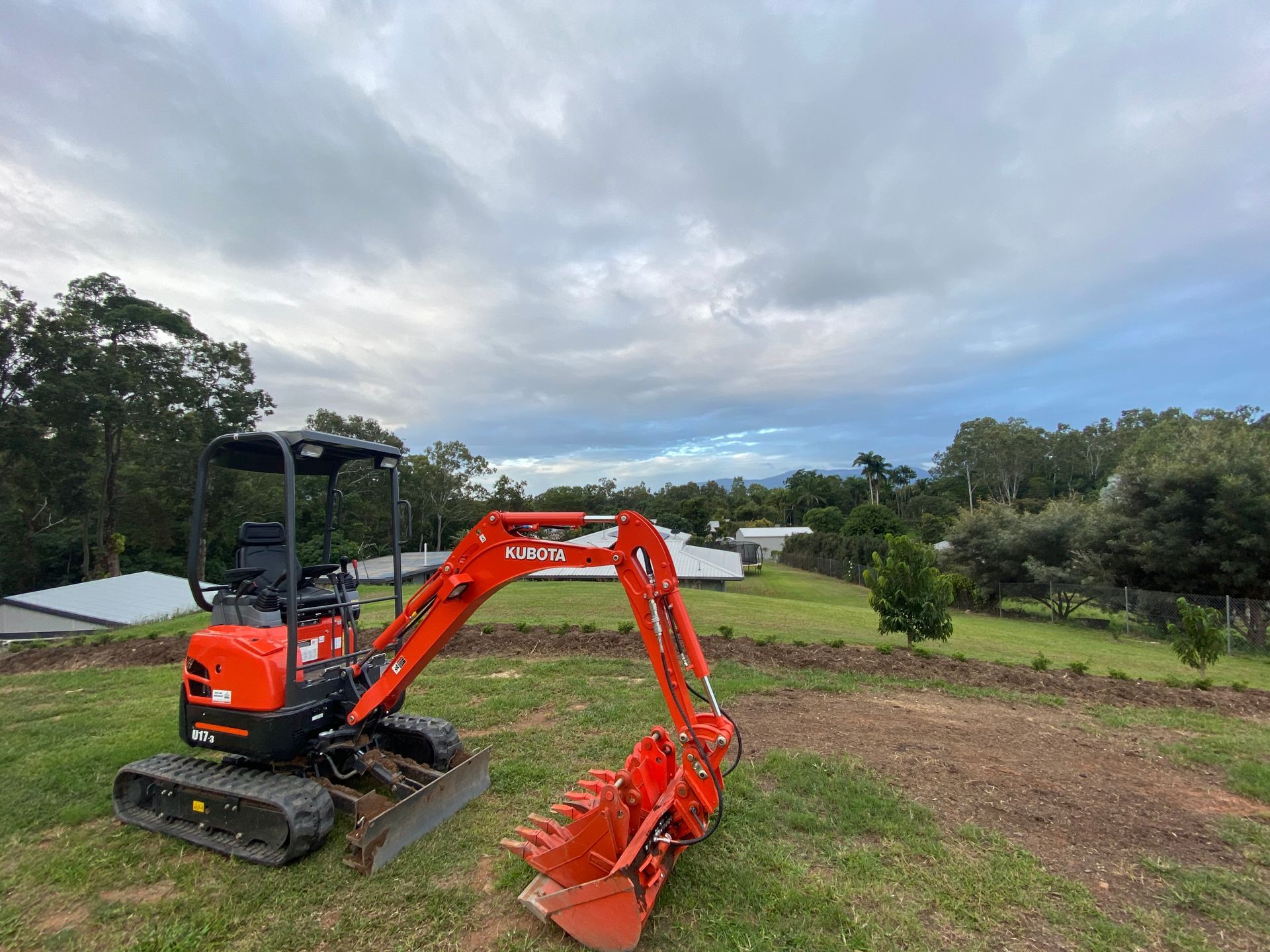 Yellow Excavator Digging at a Construction Site — Excavator Machinery & Equipment Hire in Cairns, QLD