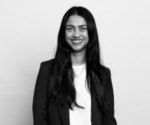 Black and white studio photo of DAF team member Priya.