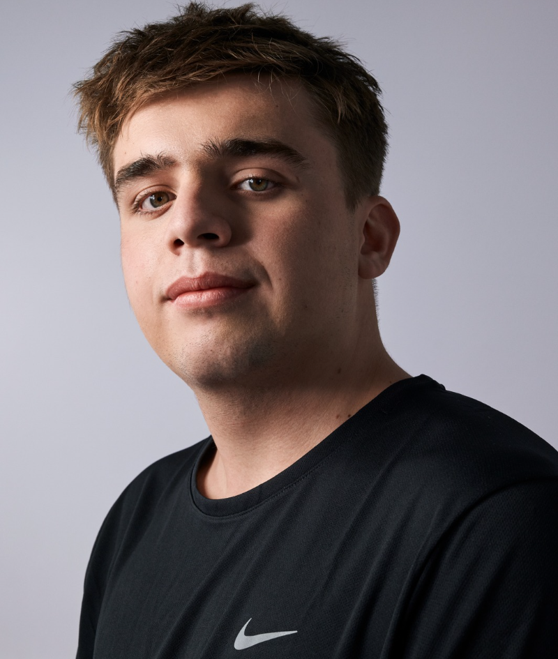 Close up studio protrait of Callum who wears a black Nike t-shirt.