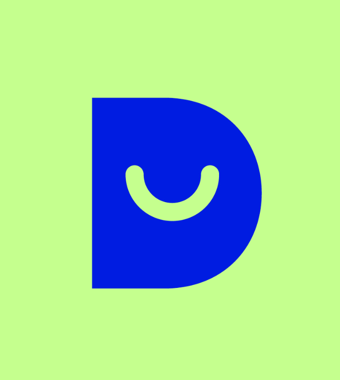 Dark blue capital D that's solid with a green smiley cut out.