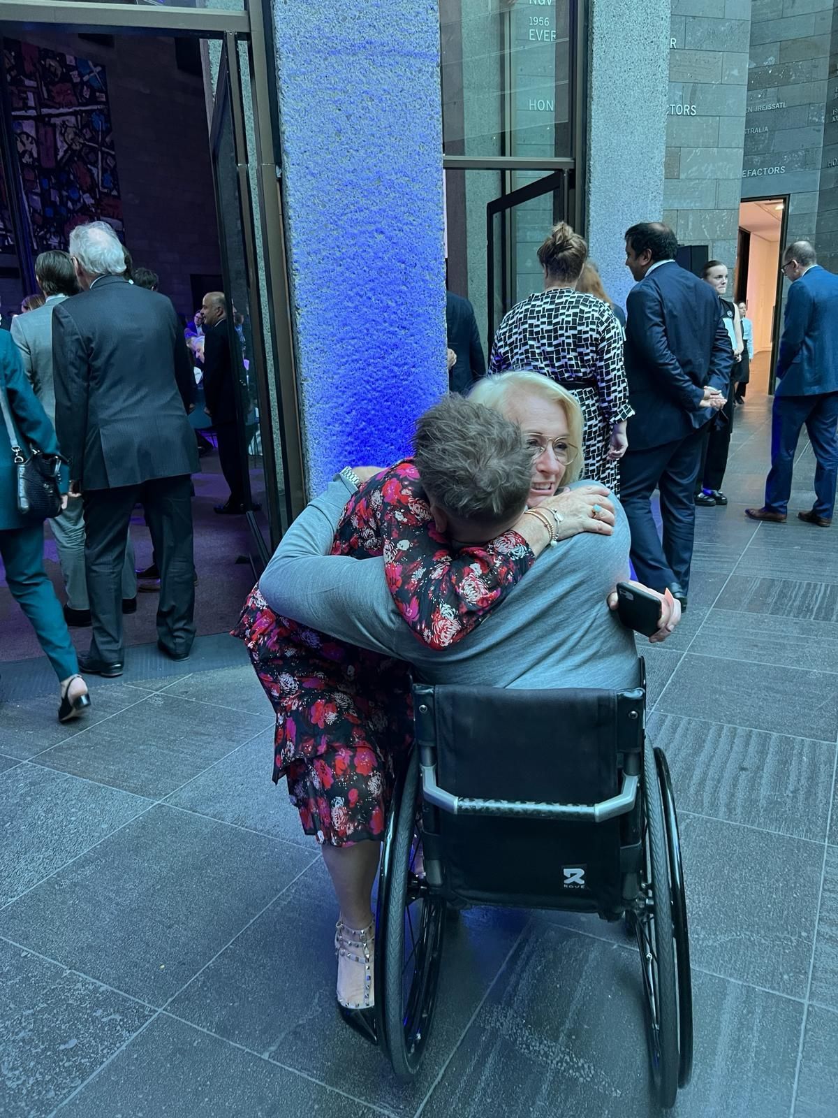 Dylan and Sally Capp embracing.