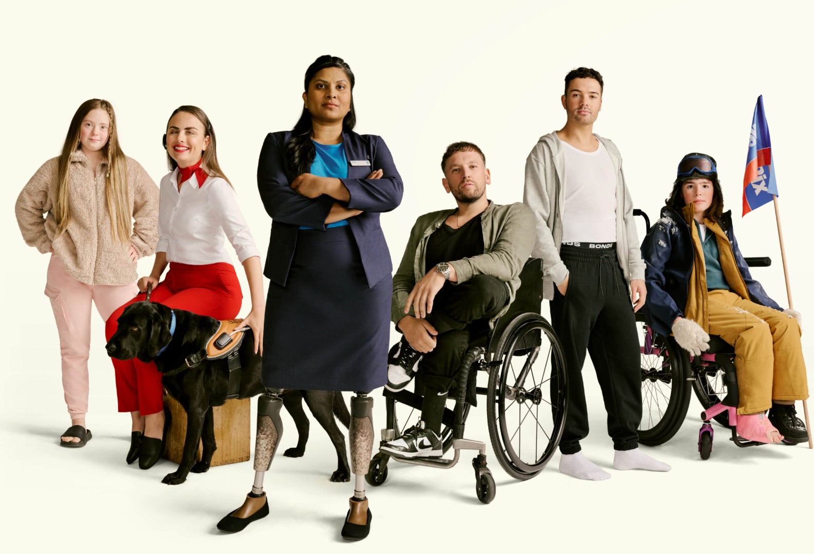 Dylan Alcott is side by side with a group of individuals who each have disability. All of these people are wearing the same clothes they wore in the television commercials they were featured in.