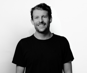 Black and white studio photo of DAF team member Charlie.