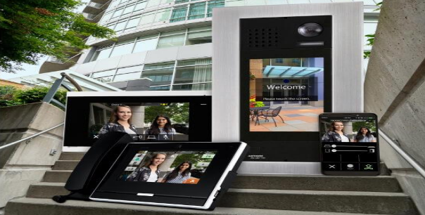 A phone and a tablet are sitting on a set of stairs in front of a building.