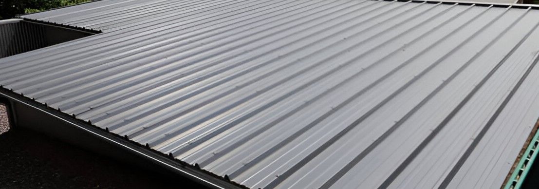 A close up of a metal roof on a house.
