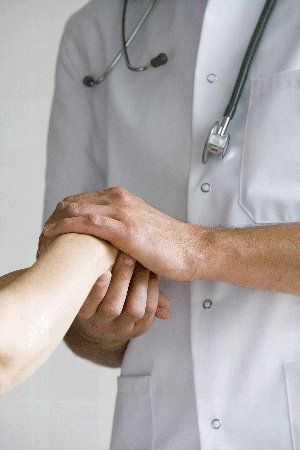doctor-holding-patients-hand