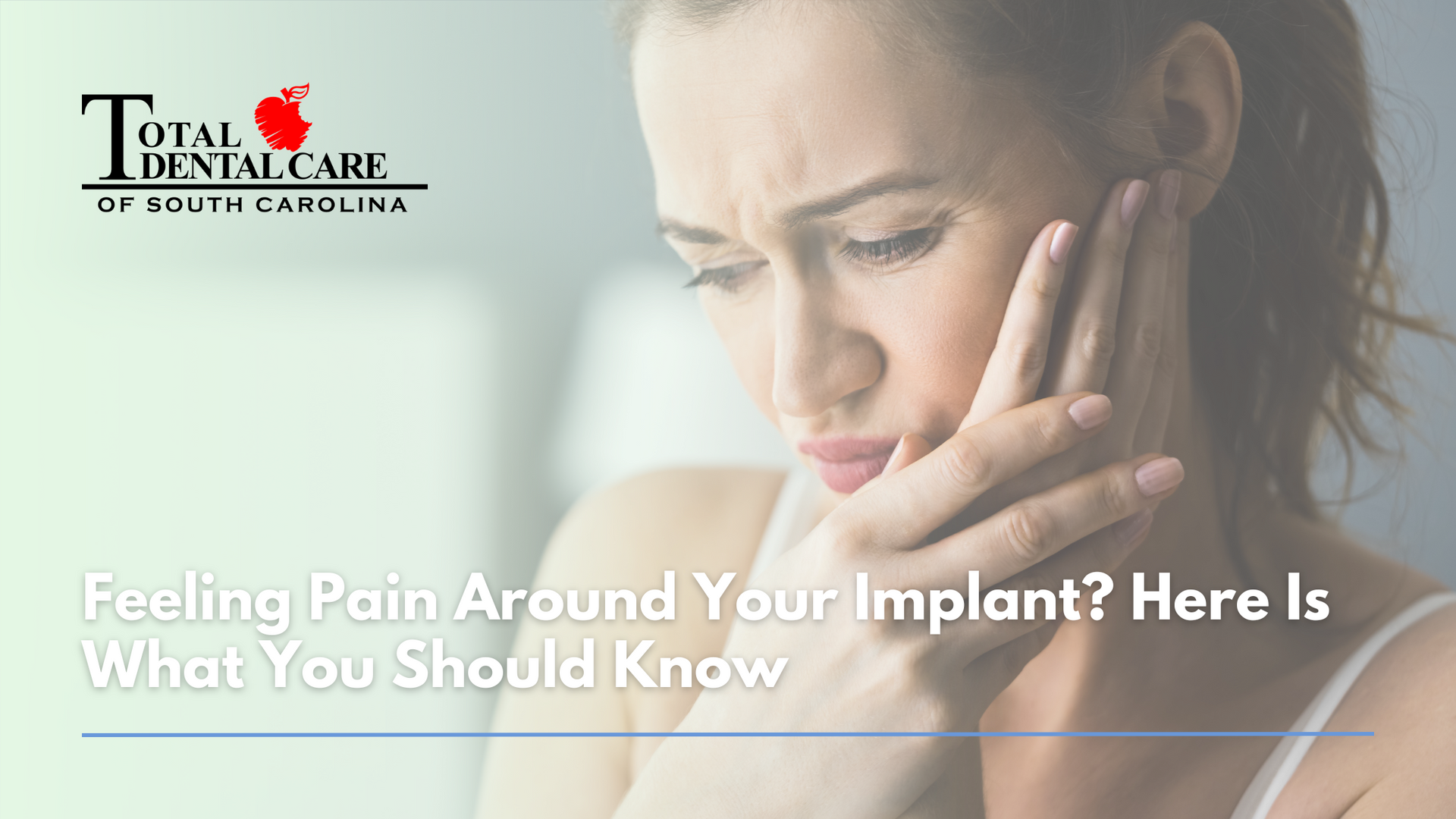A woman is holding her face in pain because of a dental implant.