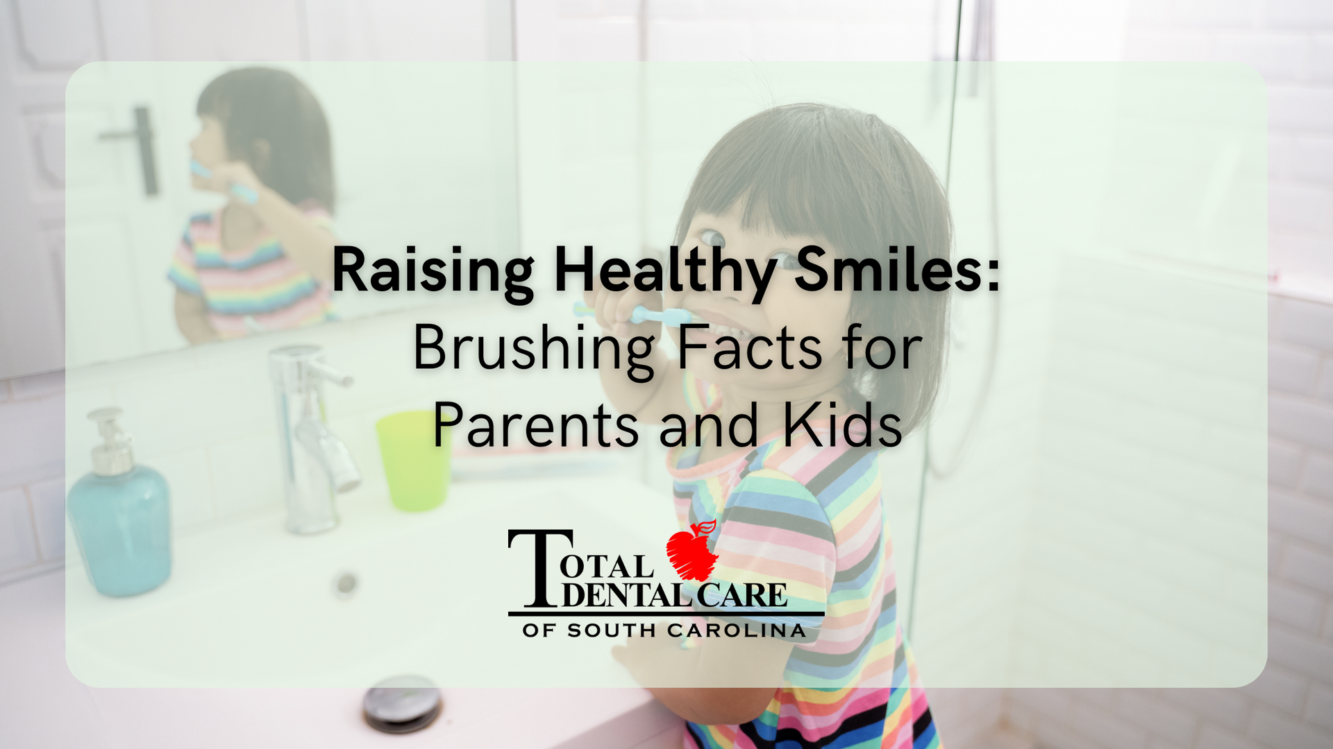A little girl is brushing her teeth in front of a mirror.