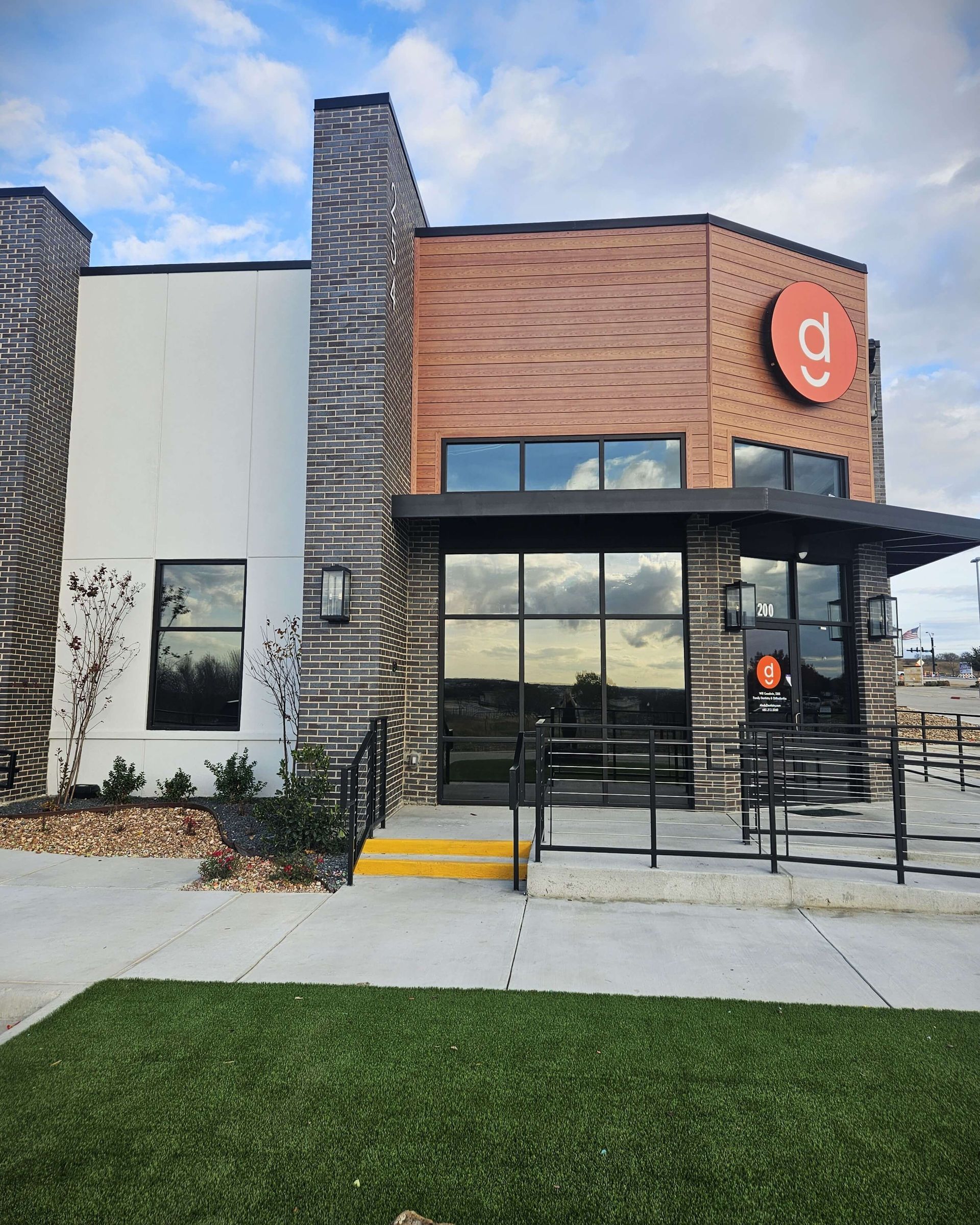 A large brick building with a red sign that says go