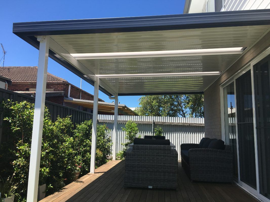 There Is A Covered Patio With A Lot Of Furniture On It — Newcastle Patio Covers In Wallsend, NSW