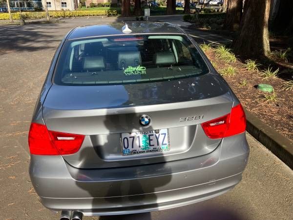 A gray bmw with a license plate that says 071 eyz