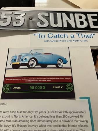 A picture of a blue car with the words `` to catch a thief '' on it.
