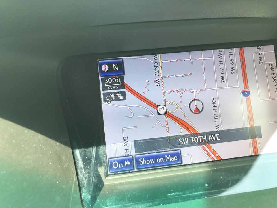 A close up of a map on a car dashboard