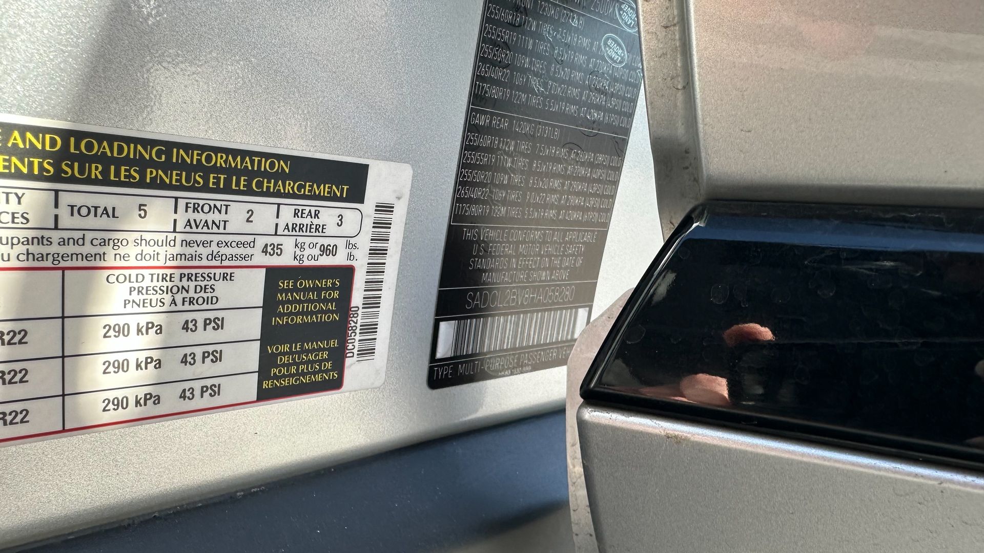A sticker on the side of a car says loading information