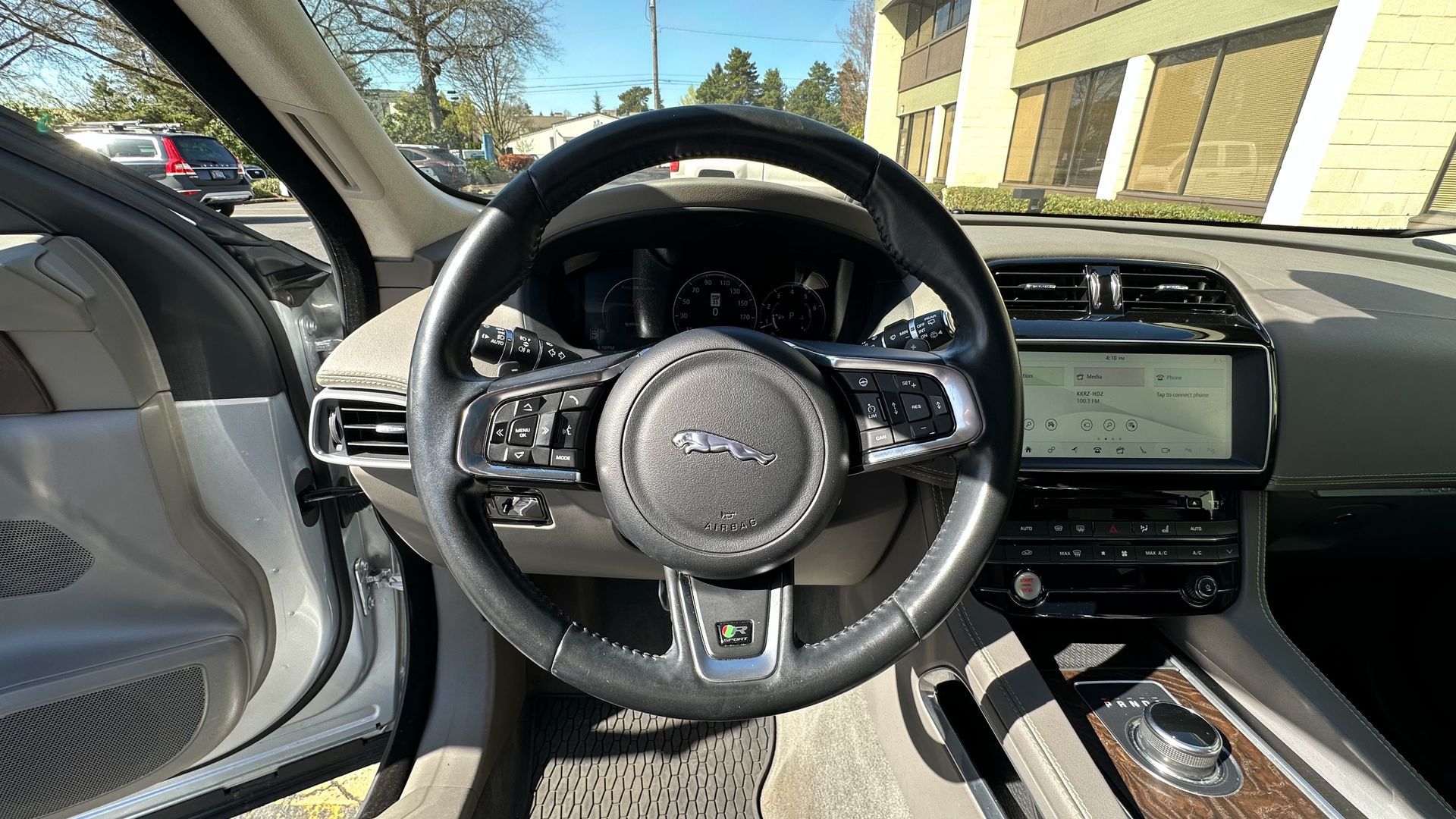 A close up of the steering wheel of a car.