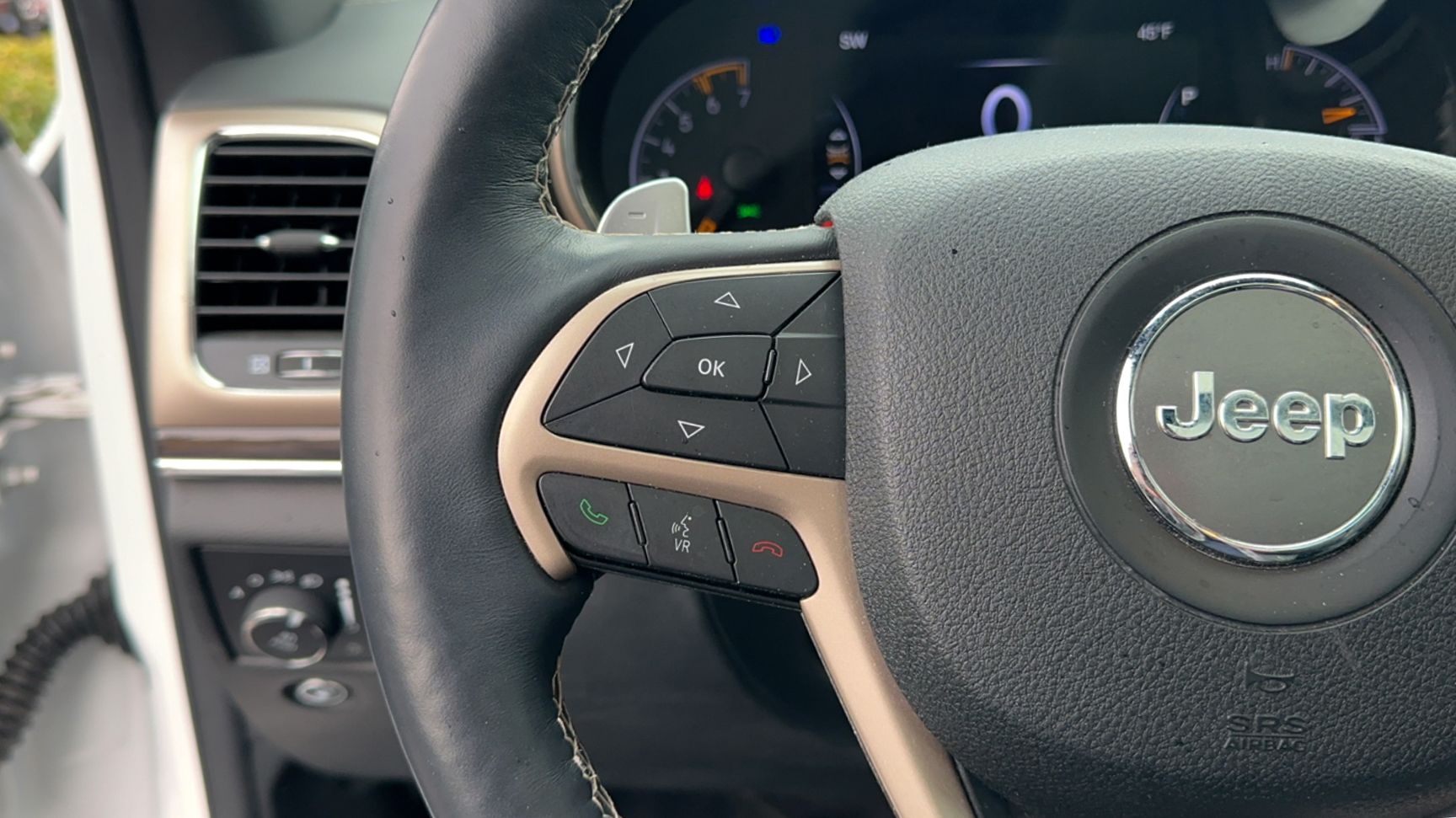 A close up of a steering wheel in a jeep