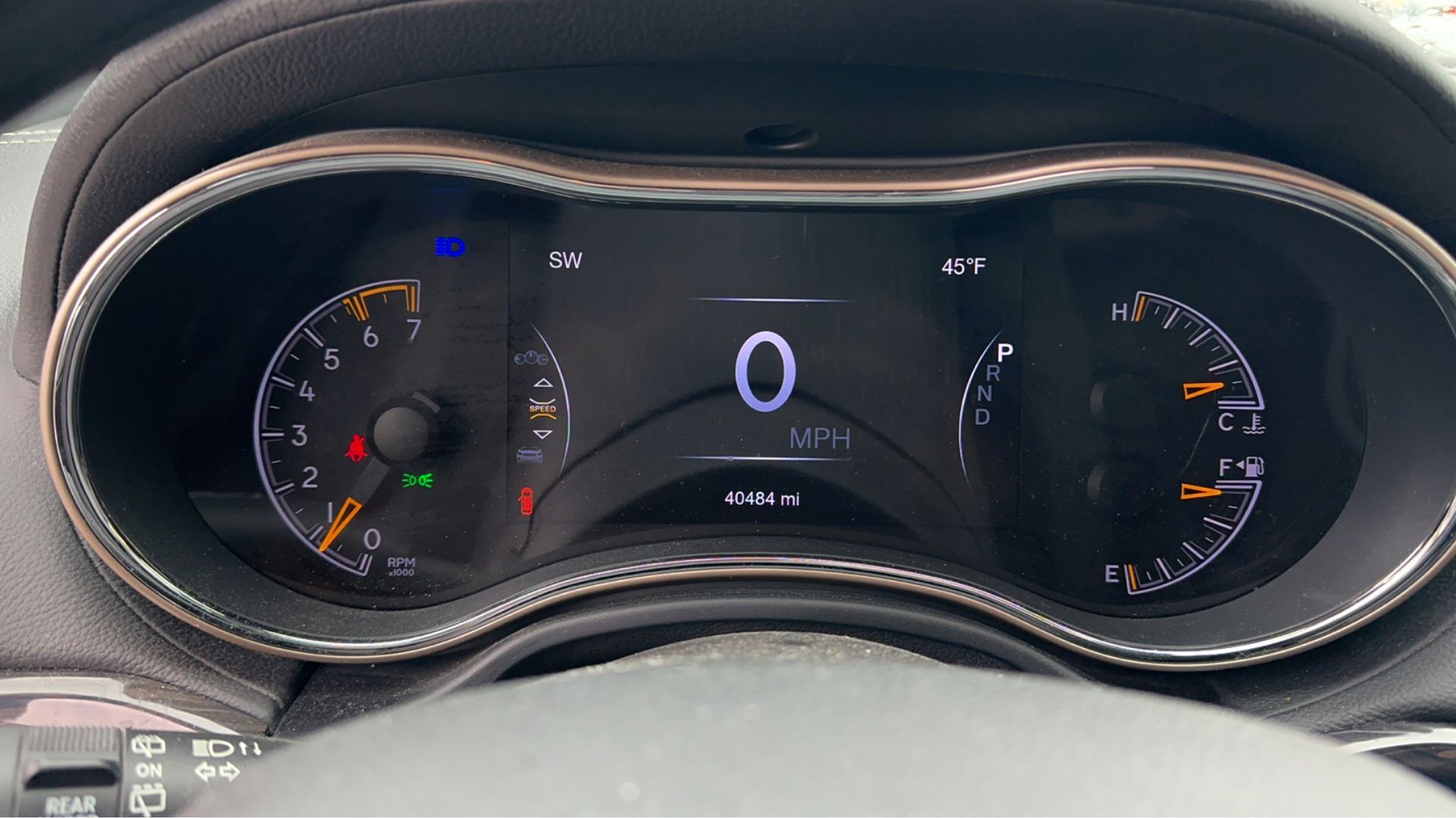 A close up of the dashboard of a car with the number 0 on it.