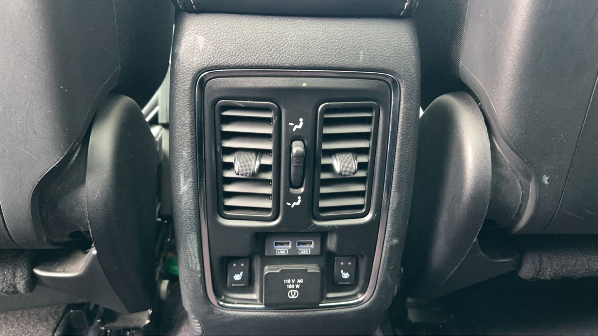 A close up of the back seat of a car.