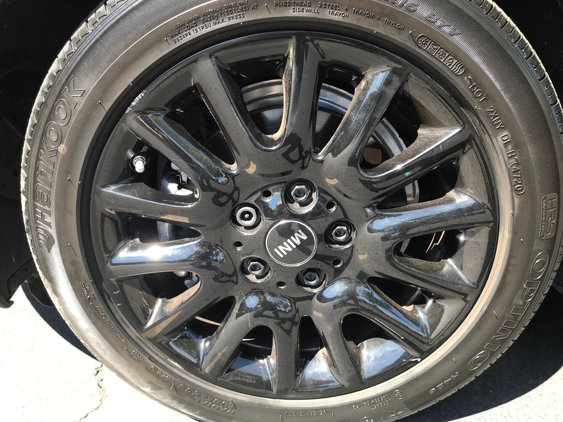 A close up of a mini wheel with a tire on it