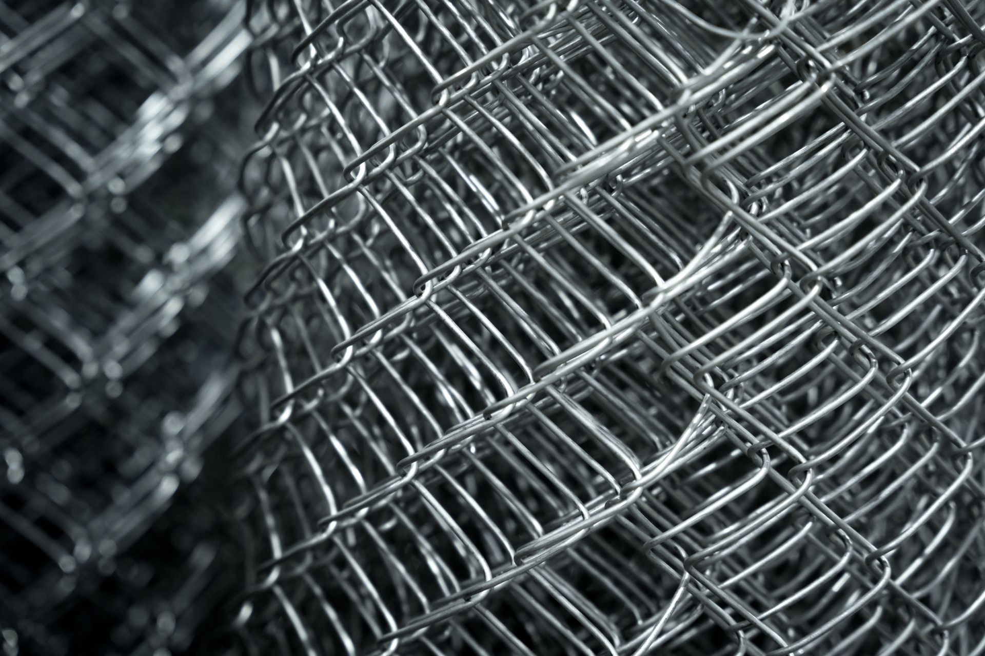 A close up of a stack of chain link fence.