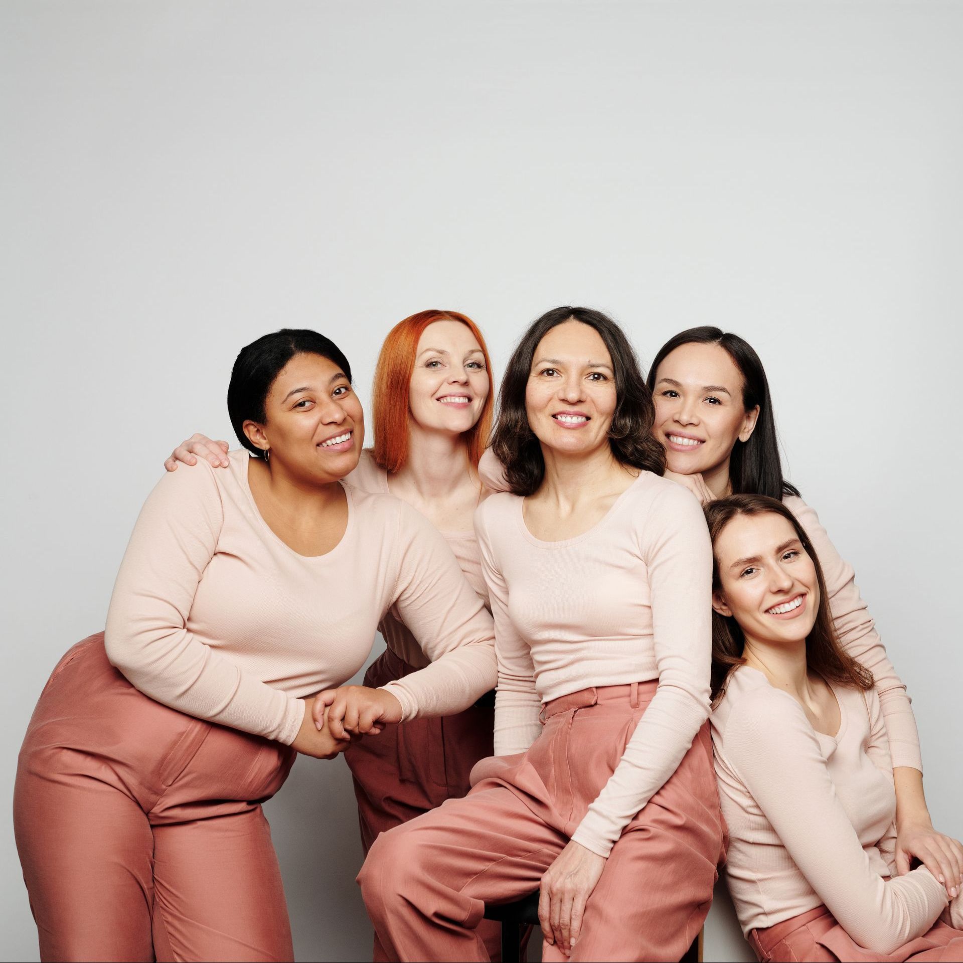 group shot of woman in pink clothing