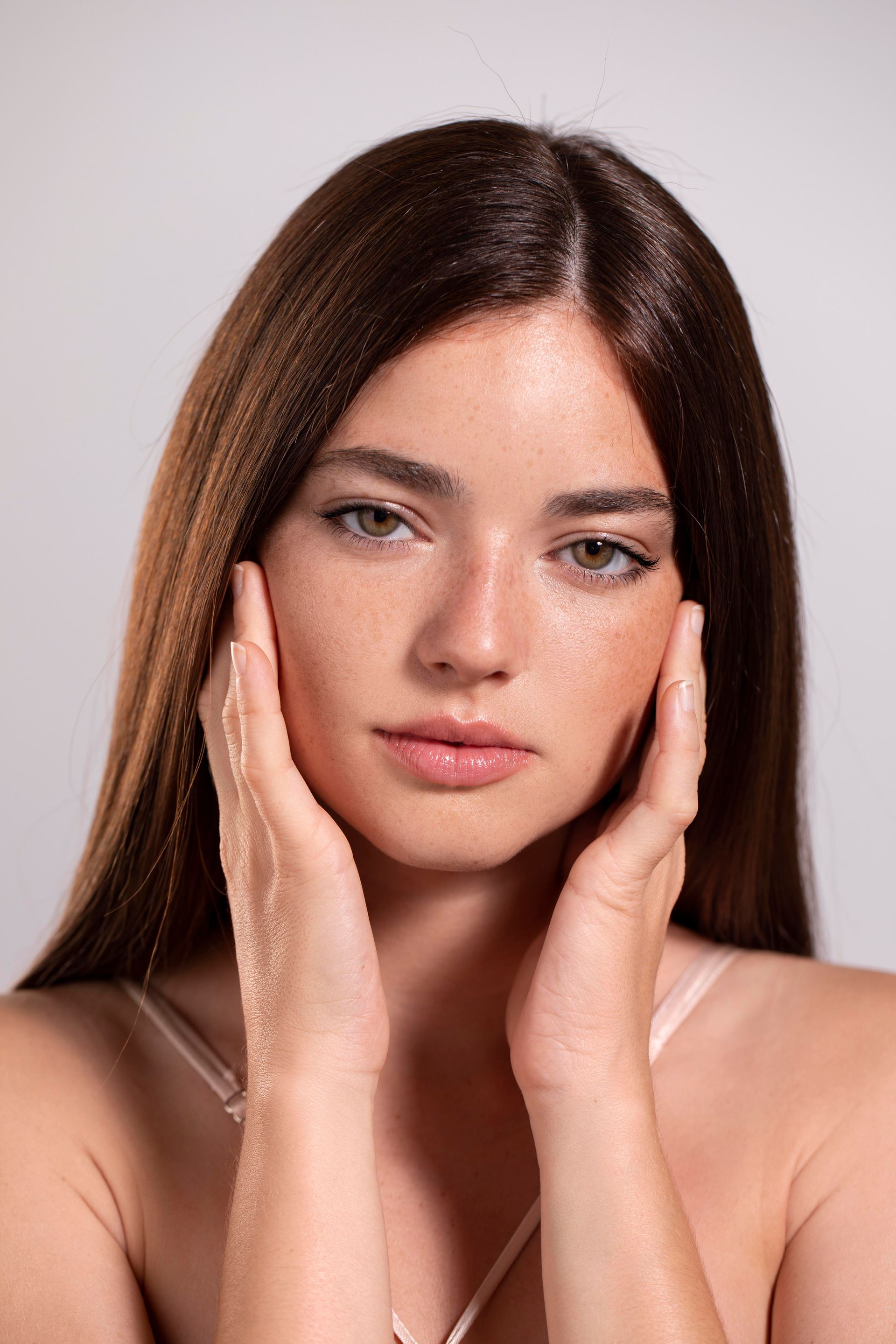 woman holding skincare product