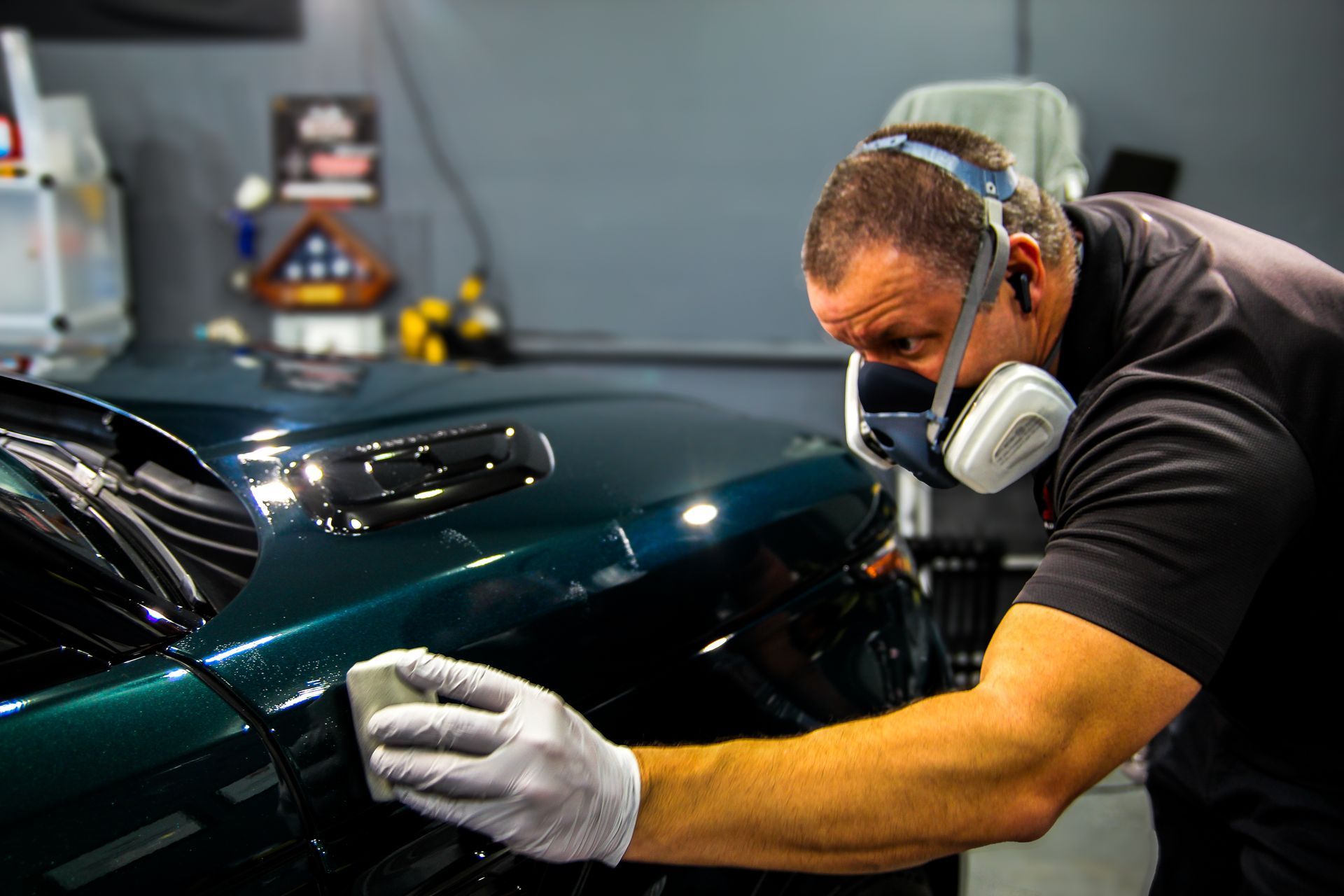 Professional ceramic coating in Chattanooga, TN being applied to a green Range Rover by Eric Potter at Ringgold Auto Detail.