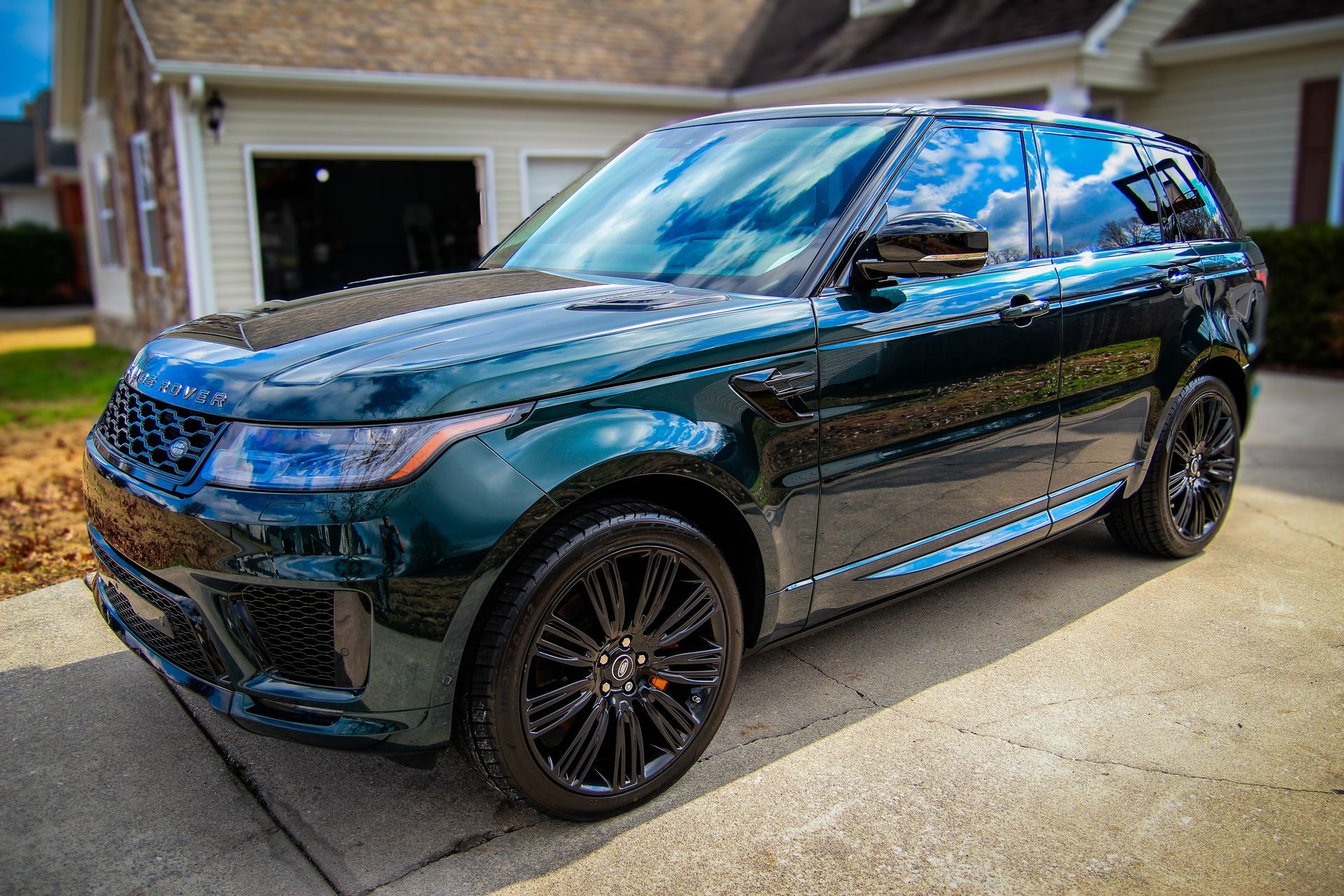 British Racing Green Range Rover Sport with an amazing reflection from paint correction and ceramic coating