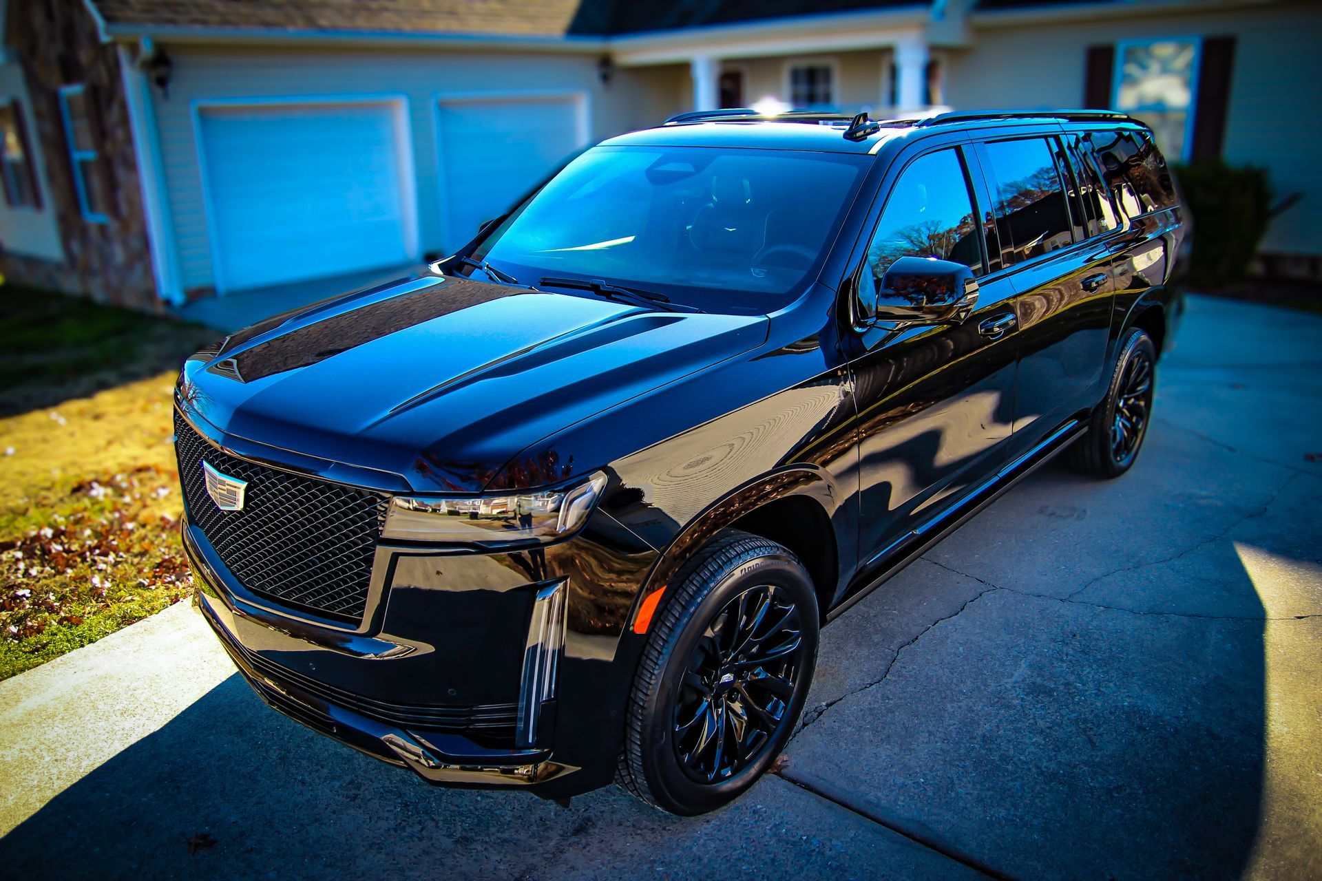 Image of a black Cadillac Escalade that has been paint corrected and ceramic coated.