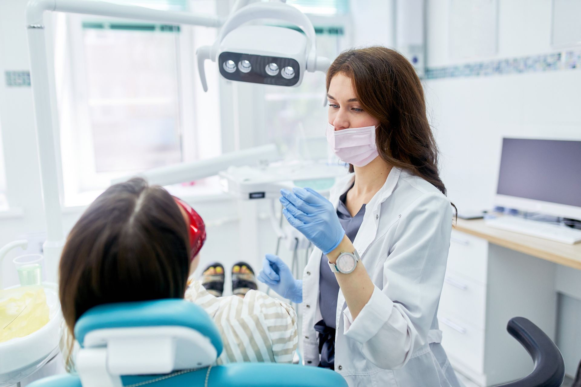 Dentist with her patient — Baraboo, WI — Baxter Dental Center