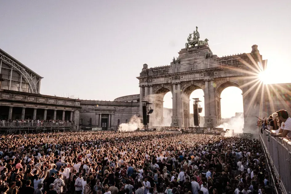 Luxury yacht on turquoise water, wooden deck, white cabin.
