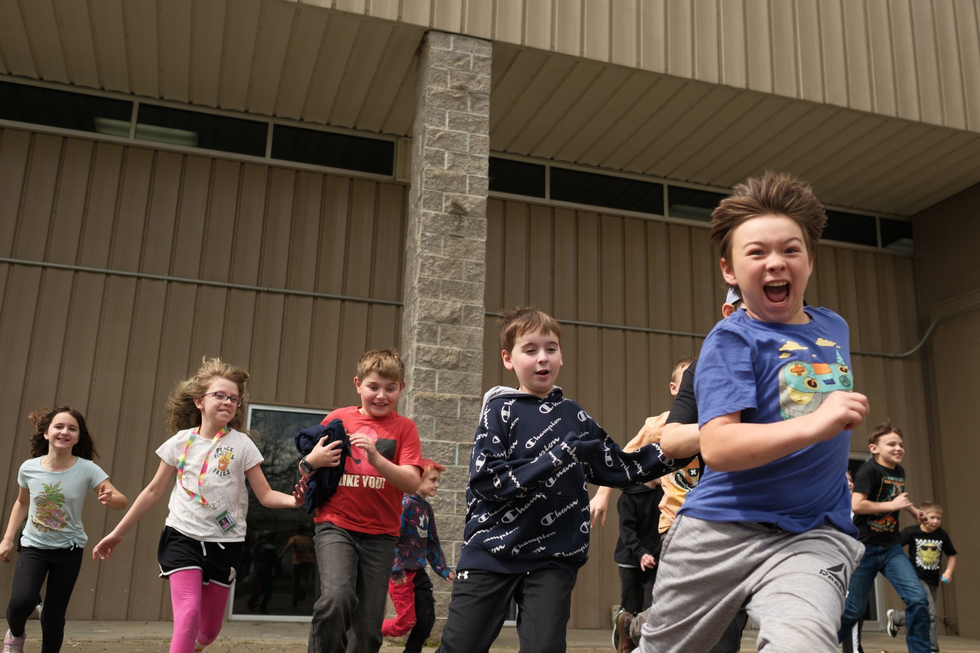 Four people wearing blue