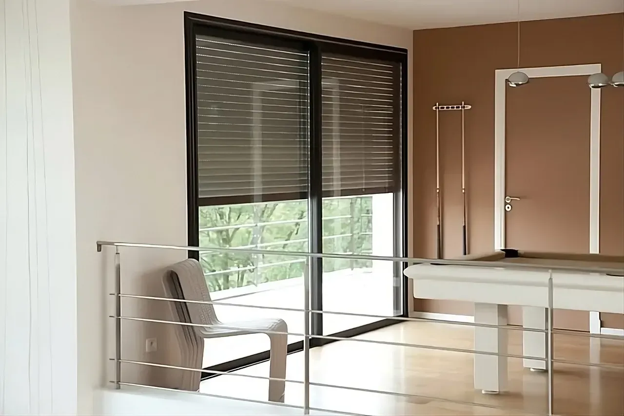 A room with a pool table and sliding glass doors — LT Shutters in Mittagong, NSW