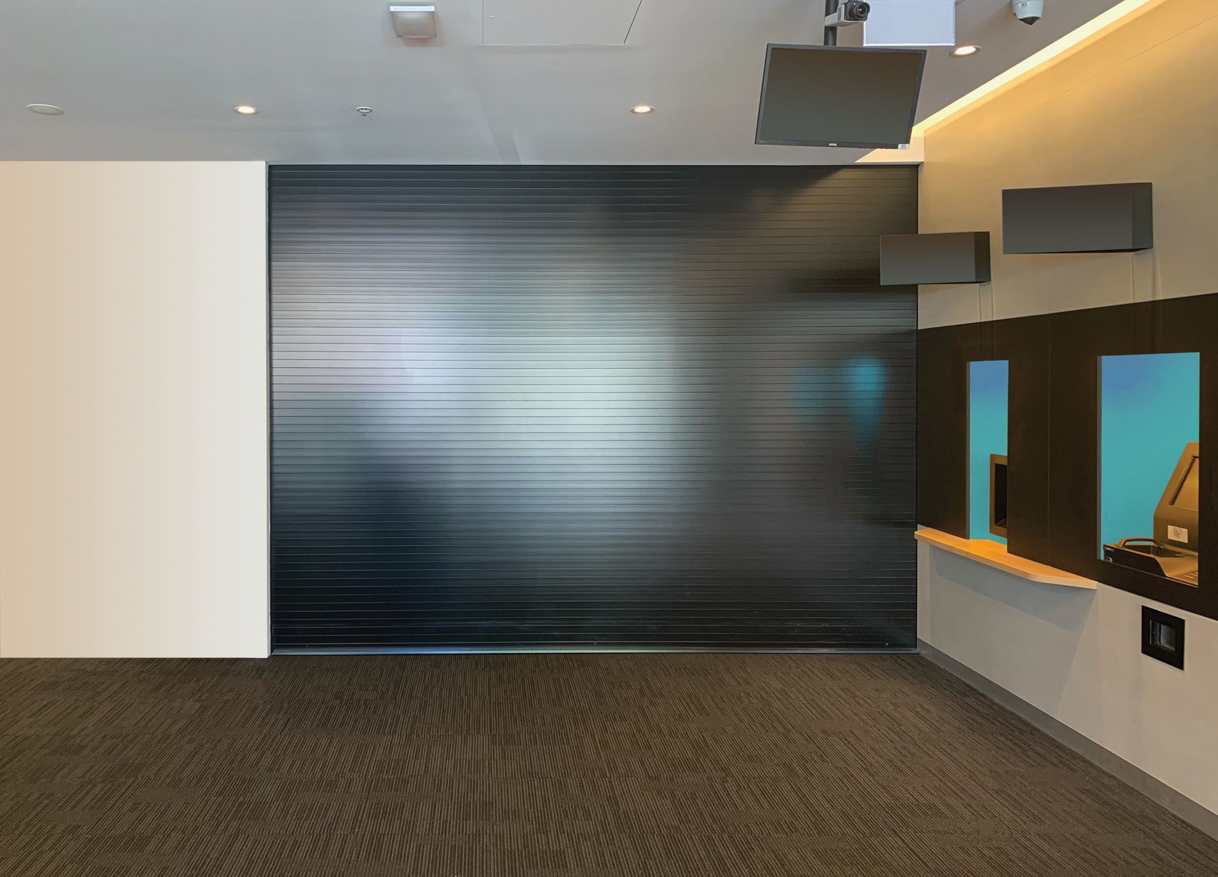 A Large Screen On A Pole Shows A Man In A Helmet — LT Shutters in Bellambi, NSW