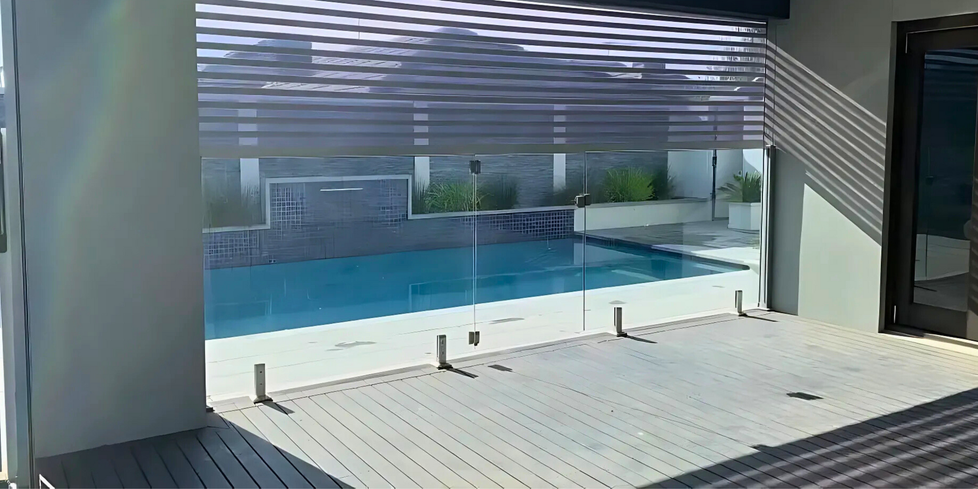 A Building With A Garage Door Open And A Table In Front Of It — LT Shutters in Wollongong, NSW