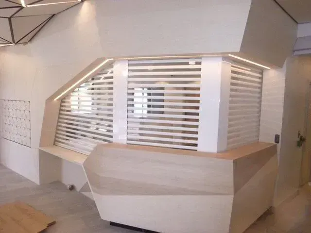 A corner of a room with a window and a wooden counter — LT Huskisson in Bellambi, NSW