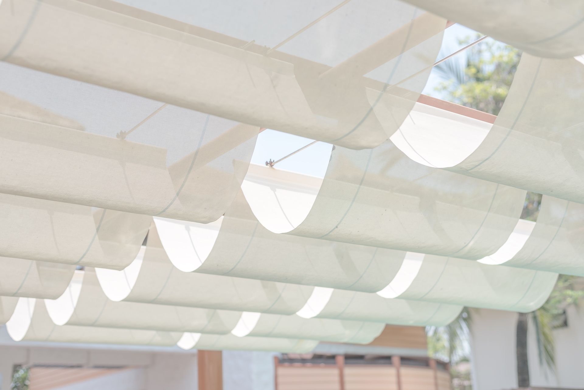 white awning shades covering a home