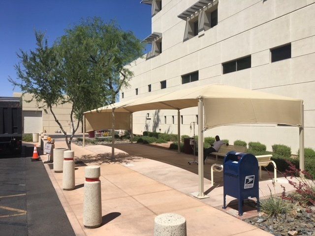 white building with a light tan awning for shade built by Arizona Awnings in Phoenix