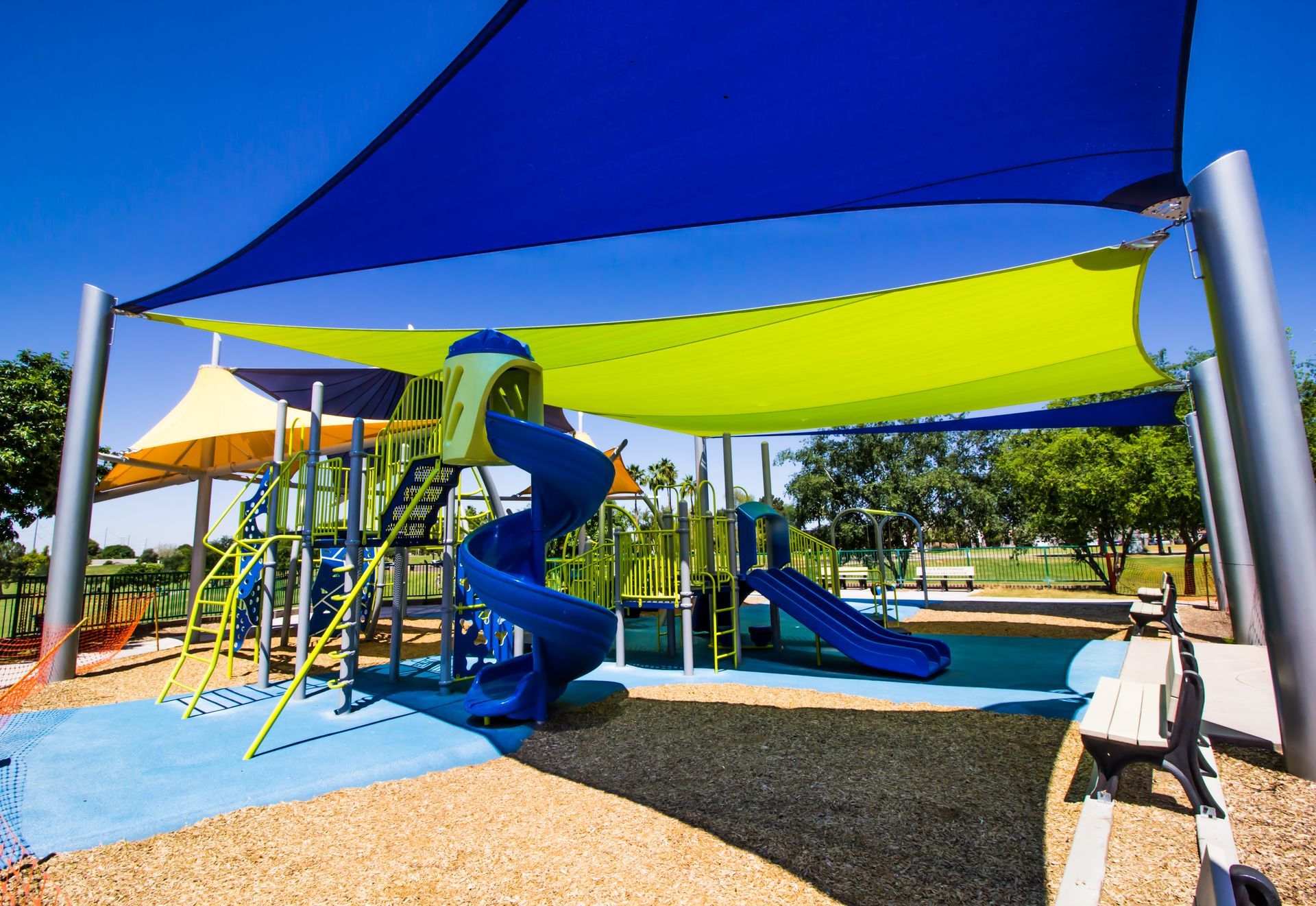 yellow and blue canopies covering a school playground