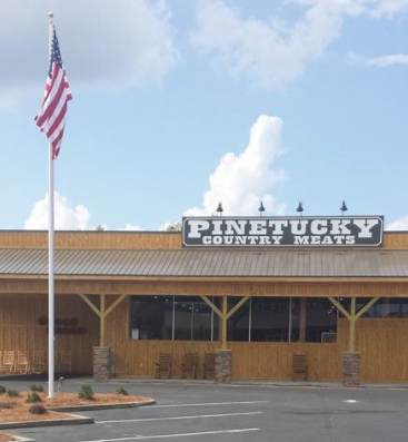 A wooden building with a sign that reads 