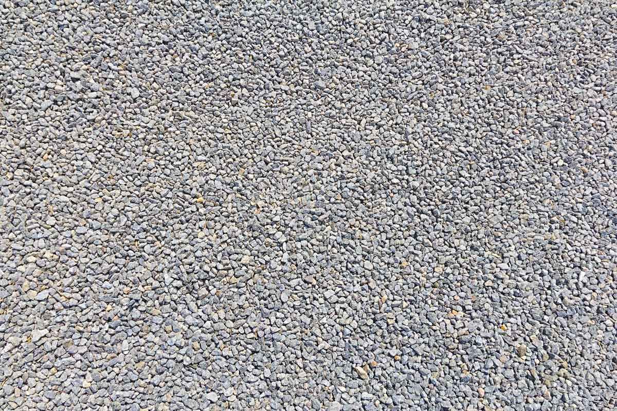 Close-up of gray and tan gravel stones filling the frame